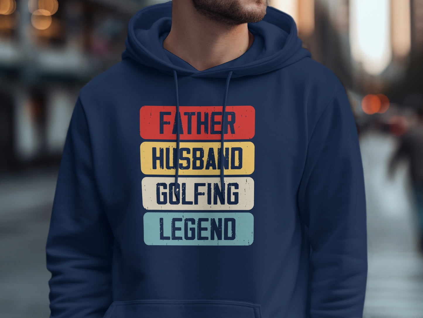 Navy hoodie with "Father Husband Golfing Legend" text in colorful blocks.