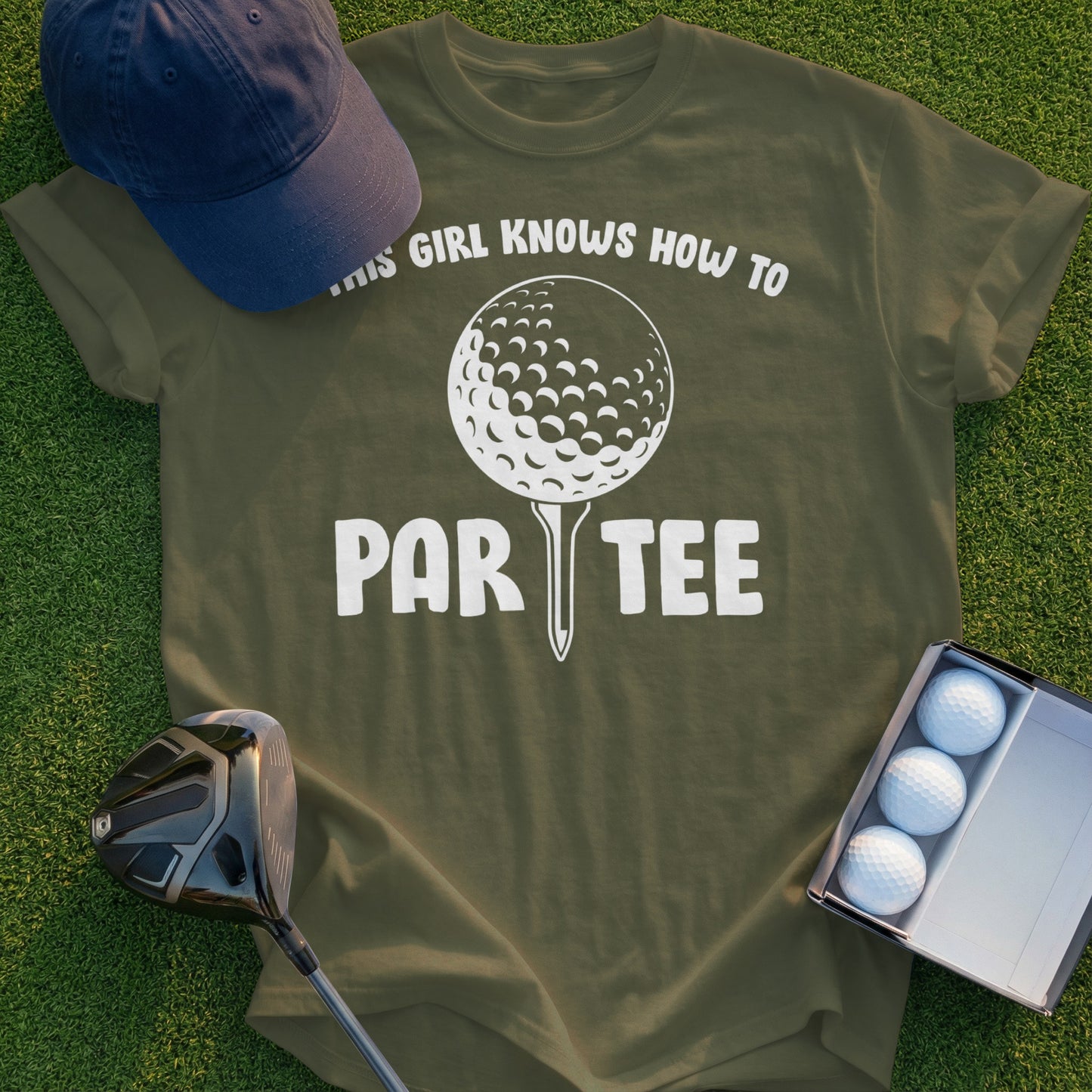 Green t-shirt with "THIS GIRL KNOWS HOW TO PAR-TEE" text and golf ball graphic.