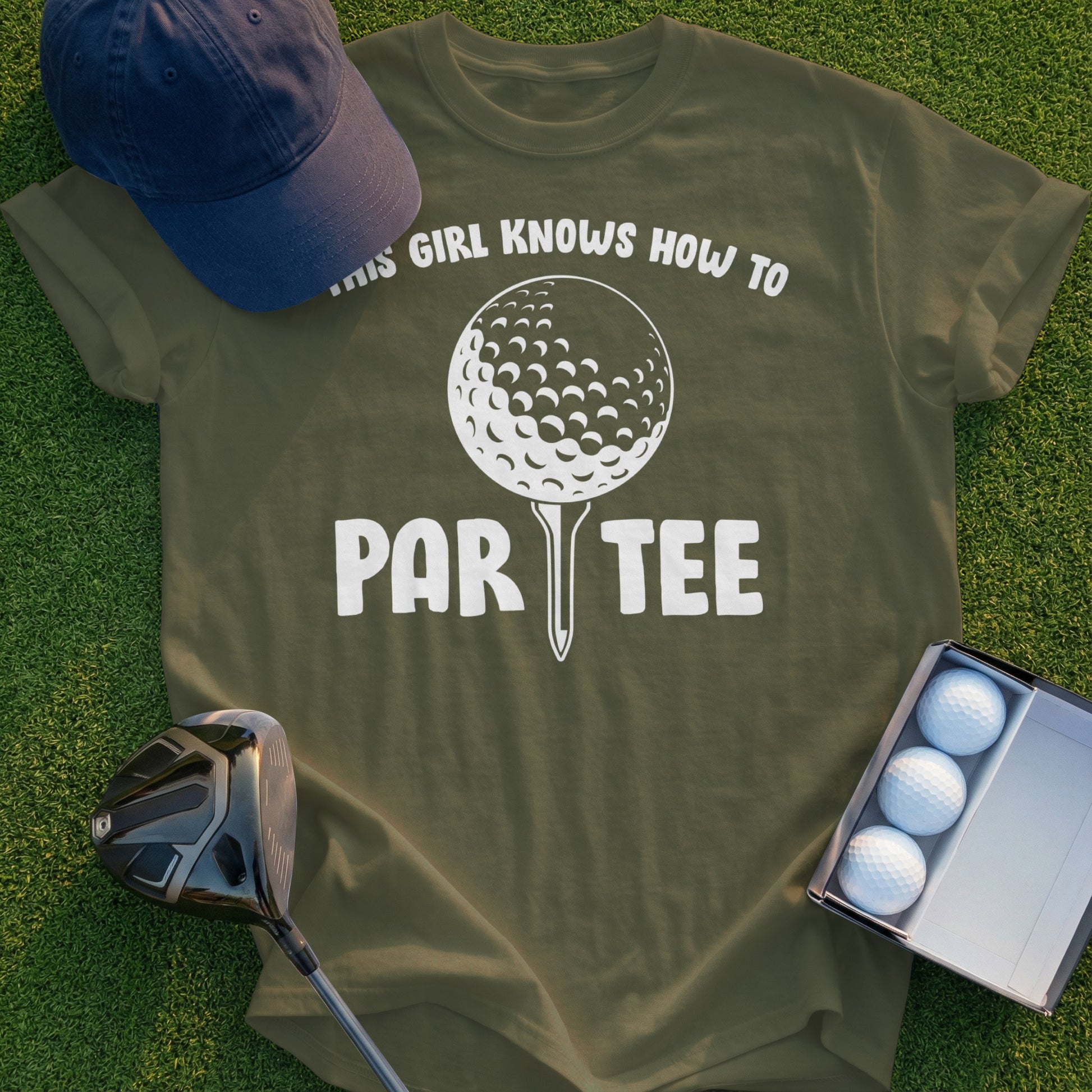 Green t-shirt with "THIS GIRL KNOWS HOW TO PAR-TEE" text and golf ball graphic.