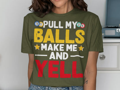 Olive green t-shirt with "PULL MY BALLS MAKE ME AND YELL" text.