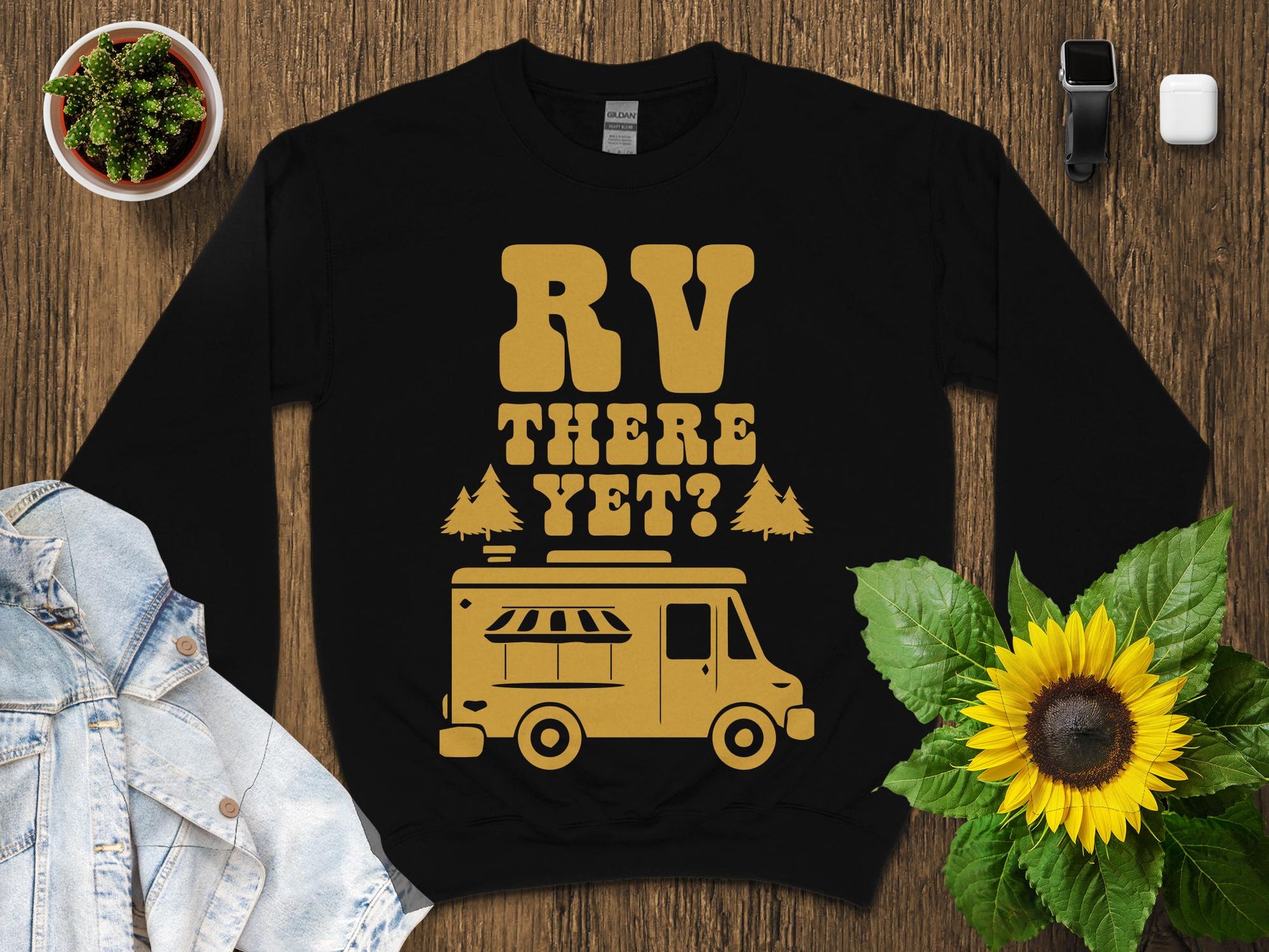 Black sweatshirt with "RV THERE YET?" and a graphic of an RV.