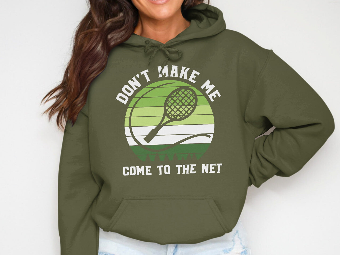 Olive hoodie with "Don't Make Me Come to the Net" tennis graphic.