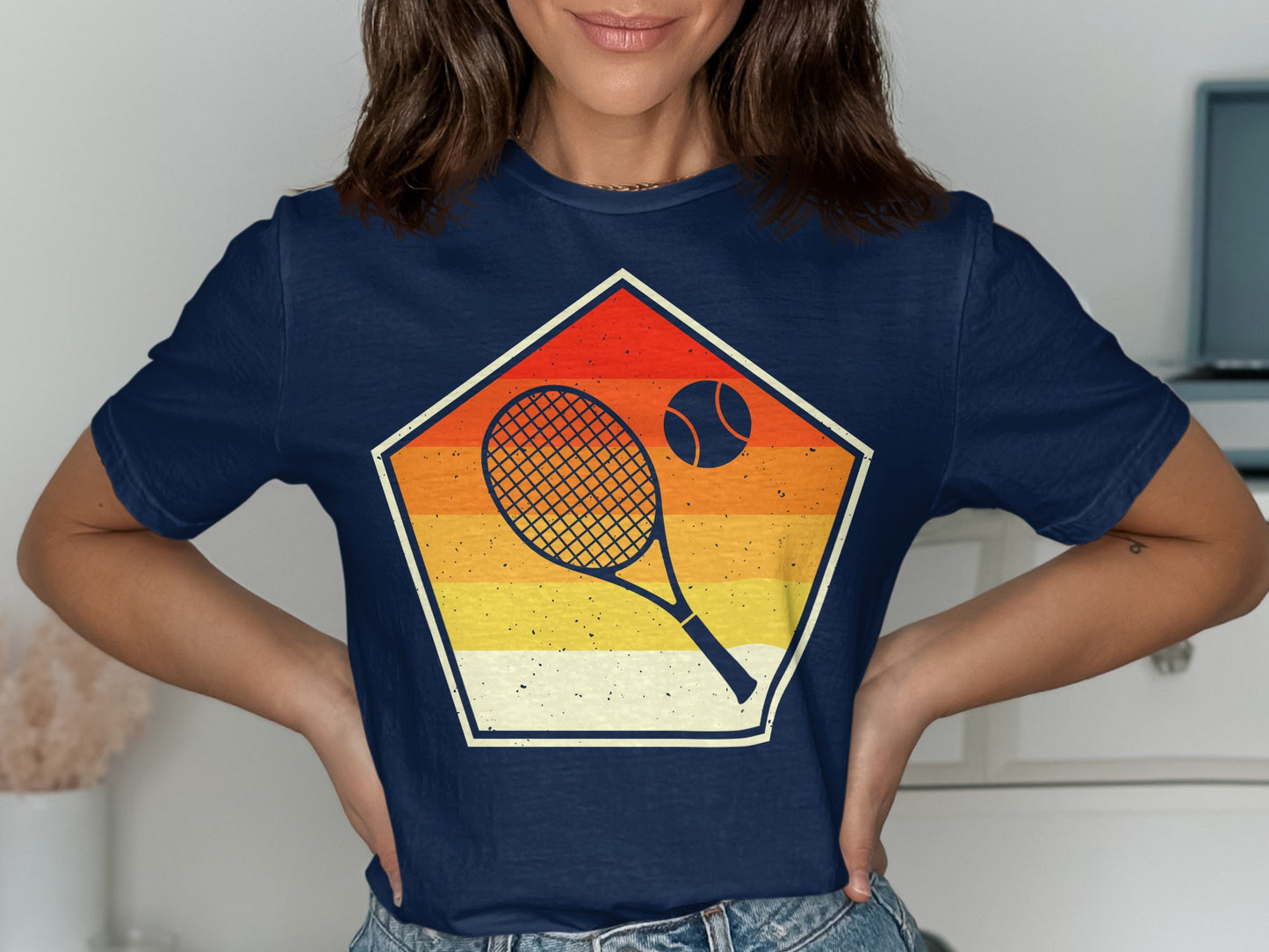 Navy t-shirt with a vintage sunset-themed pentagon featuring a tennis racket and ball.