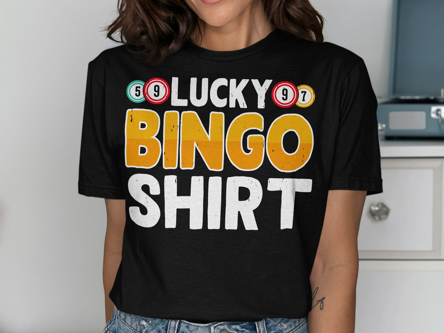 Black t-shirt with "LUCKY BINGO SHIRT" printed in colorful letters.