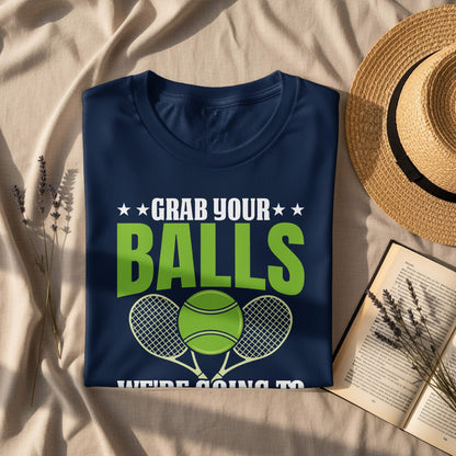 Navy t-shirt with "GRAB YOUR BALLS" and tennis rackets.