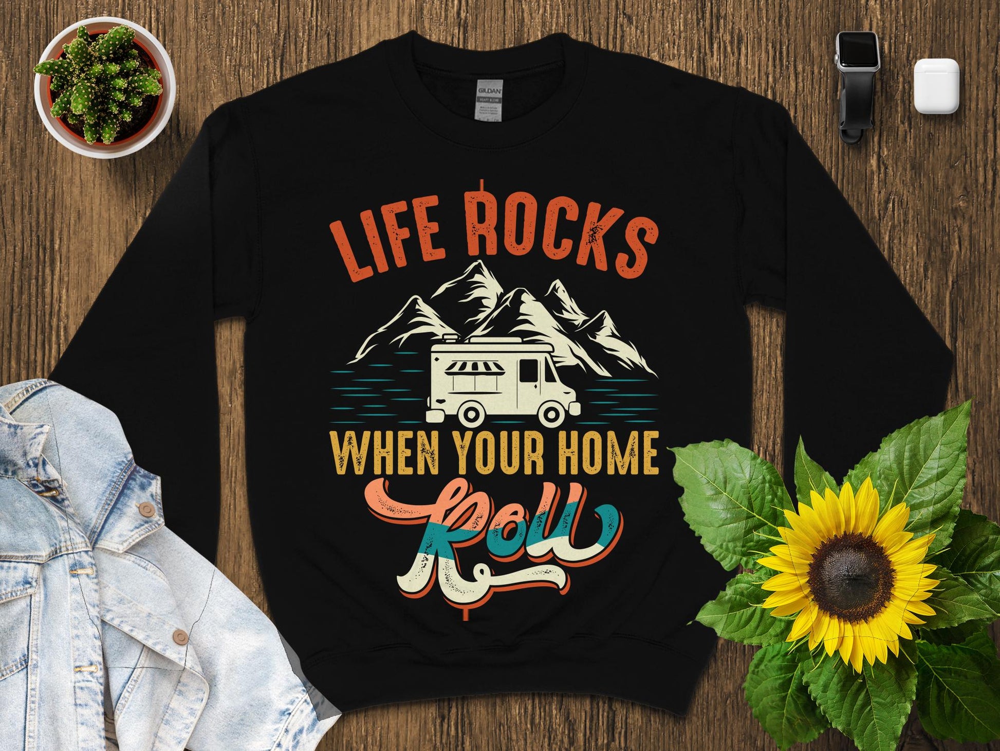 Black sweatshirt with "Life Rocks When Your Home Roll" and RV camper graphic.