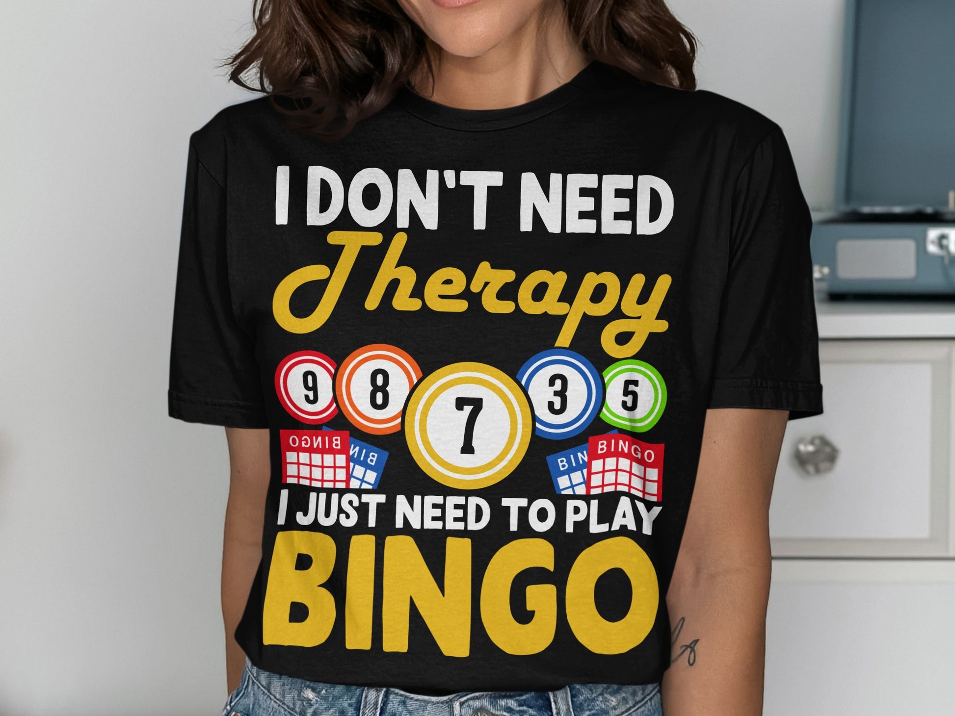 Black t-shirt with "I DON'T NEED Therapy I JUST NEED TO PLAY BINGO" text and bingo balls.