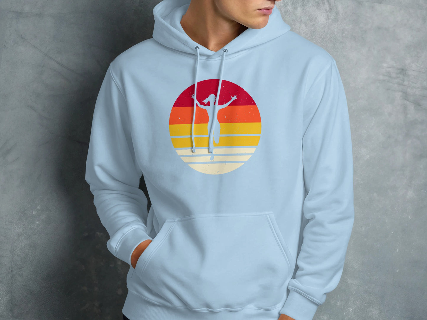 Light blue hoodie with a sunset graphic featuring a silhouetted runner.