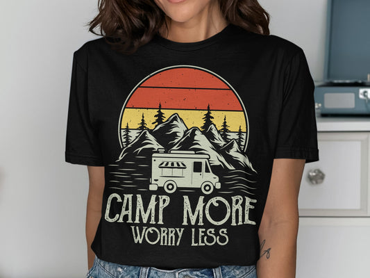 Black t-shirt with "Camp More Worry Less" text and camper van illustration.