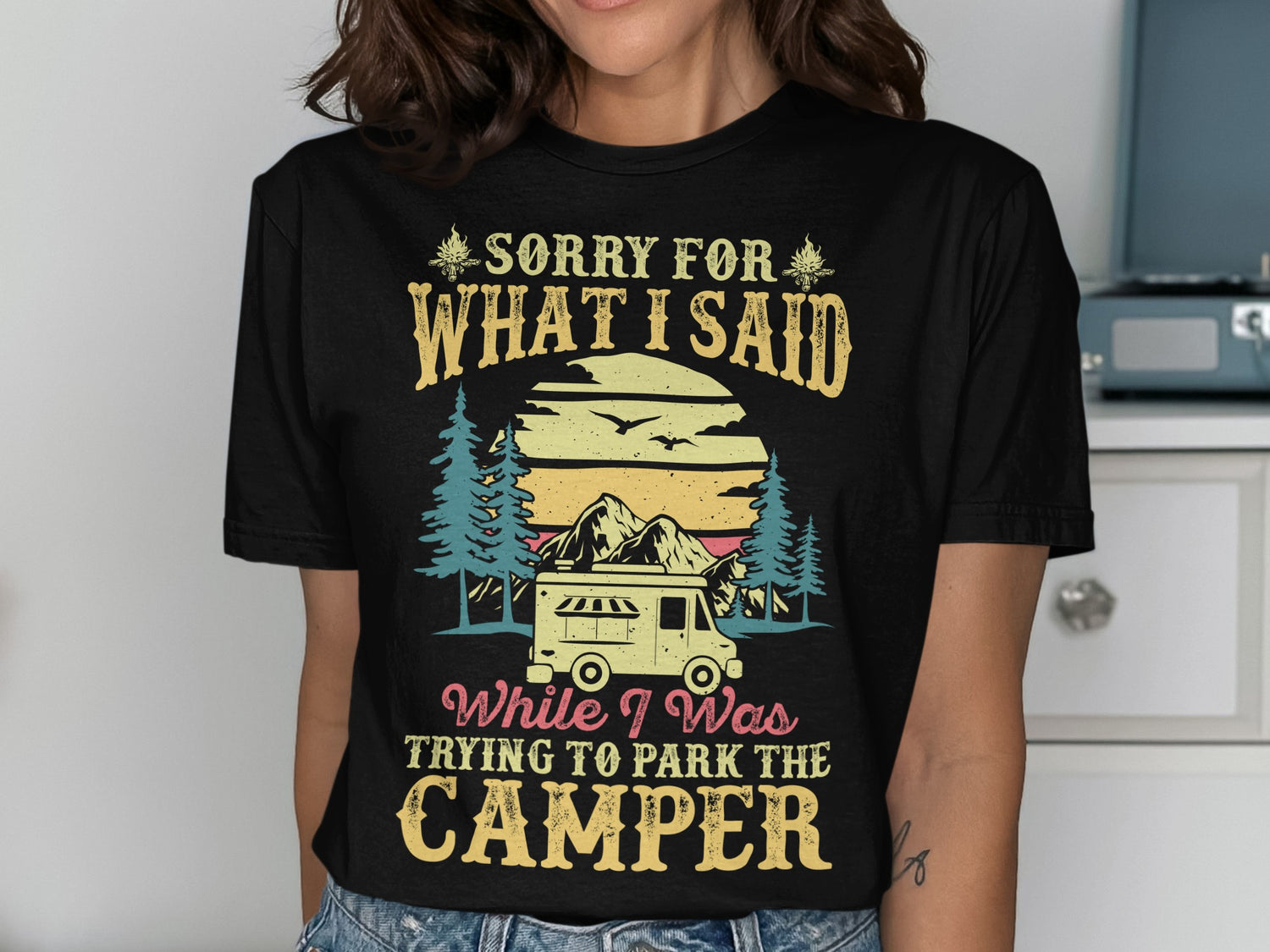 Black t-shirt with "Sorry for what I said while trying to park the camper" text and RV graphic.