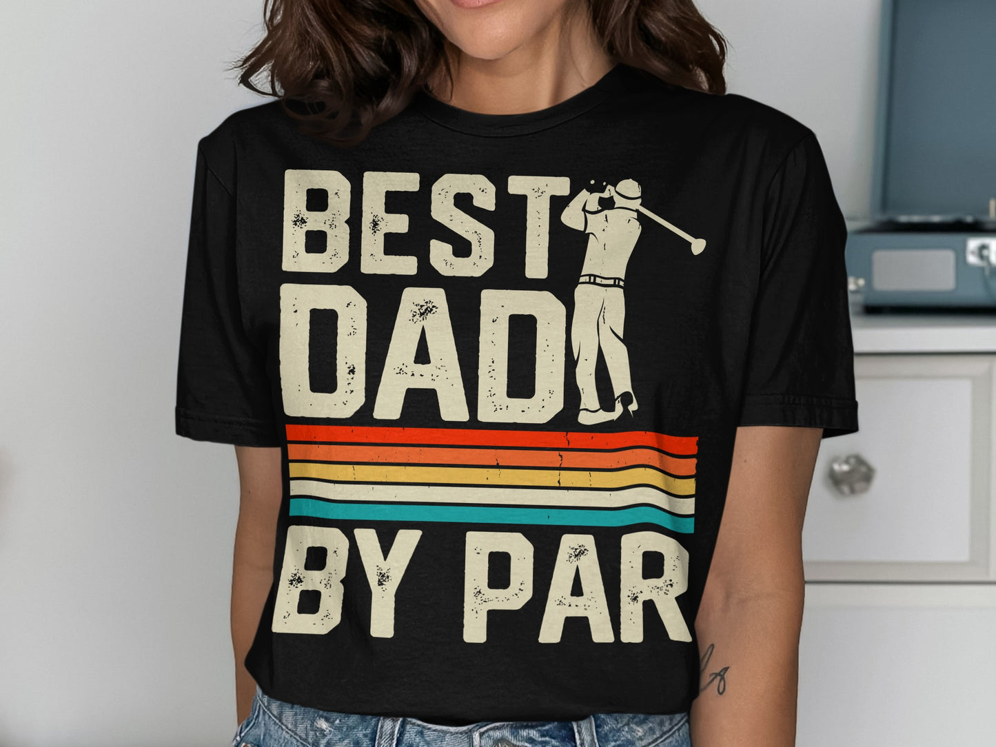 Black t-shirt with "BEST DAD BY PAR" text and golfer graphic.