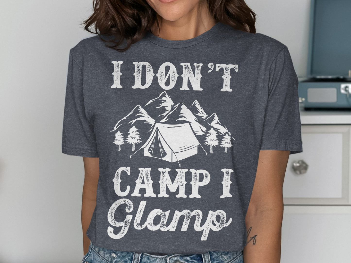 Dark gray t-shirt with "I Don't Camp I Glamp" text and mountain and tent graphic.