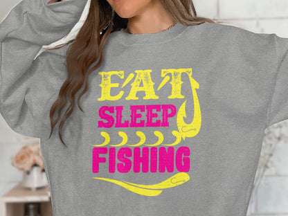 Grey sweatshirt with "Eat Sleep Fishing" in yellow and pink text.