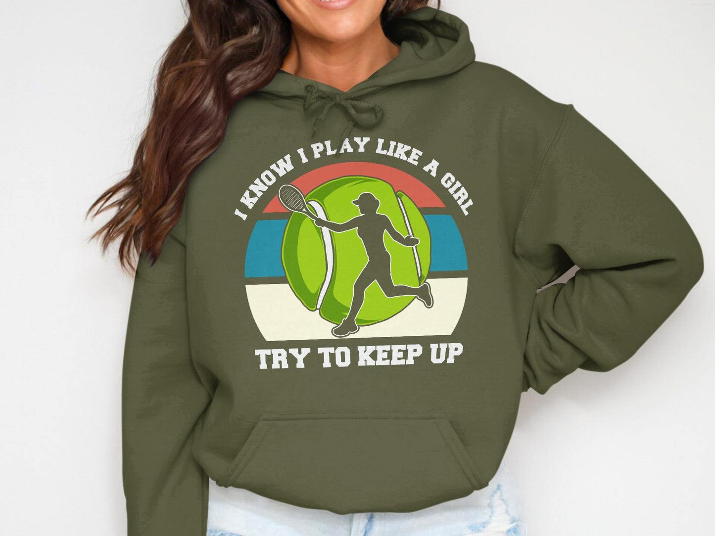 Green hoodie with "I know I play like a girl try to keep up" text and tennis graphic.