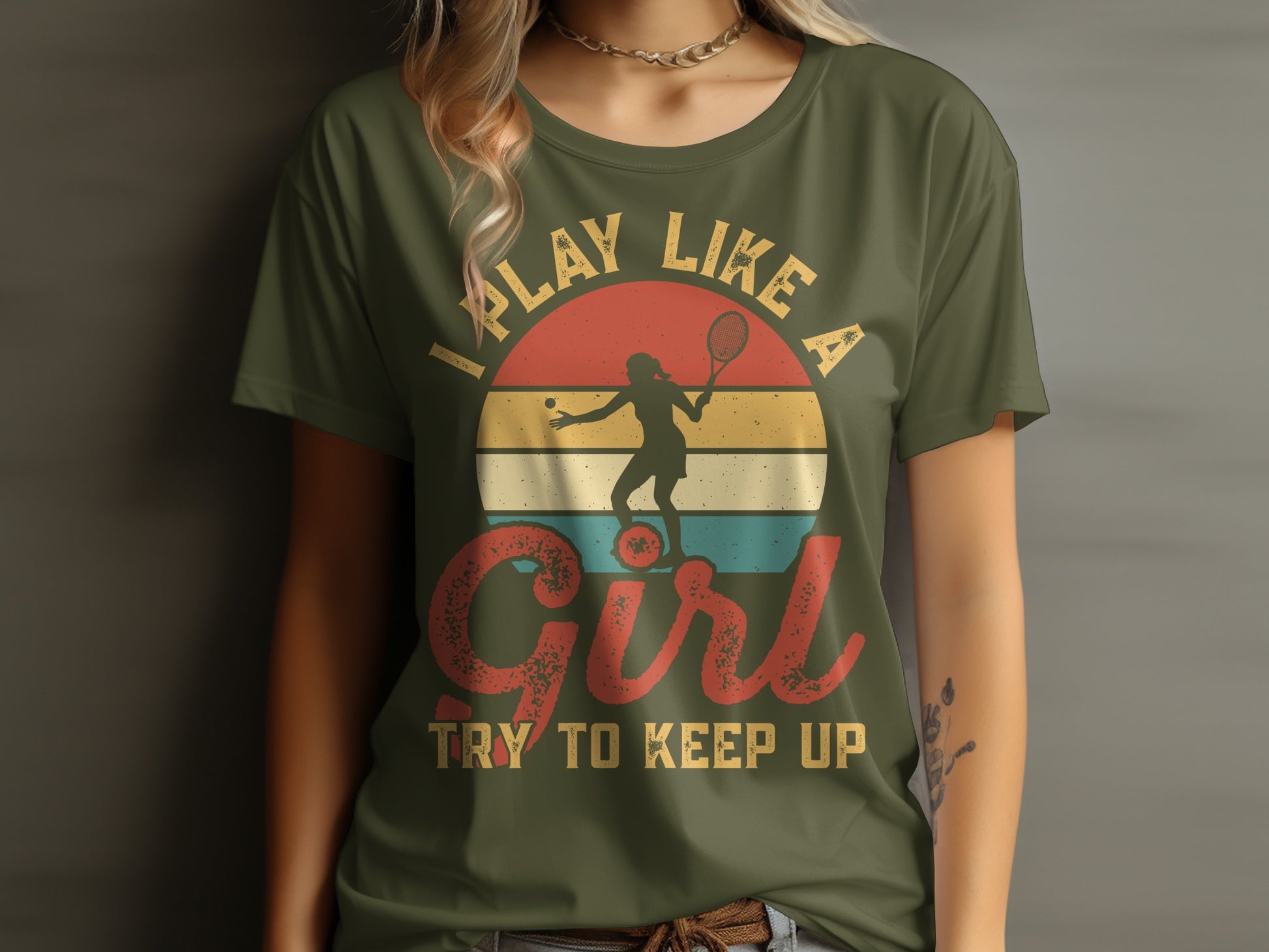 "Play like a girl" text on a t-shirt with a tennis player silhouette.