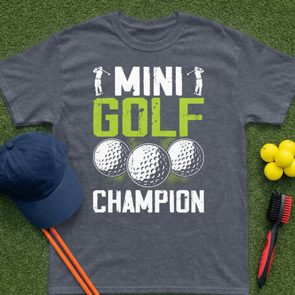 Dark gray t-shirt with "Mini Golf Champion" text and golf balls.