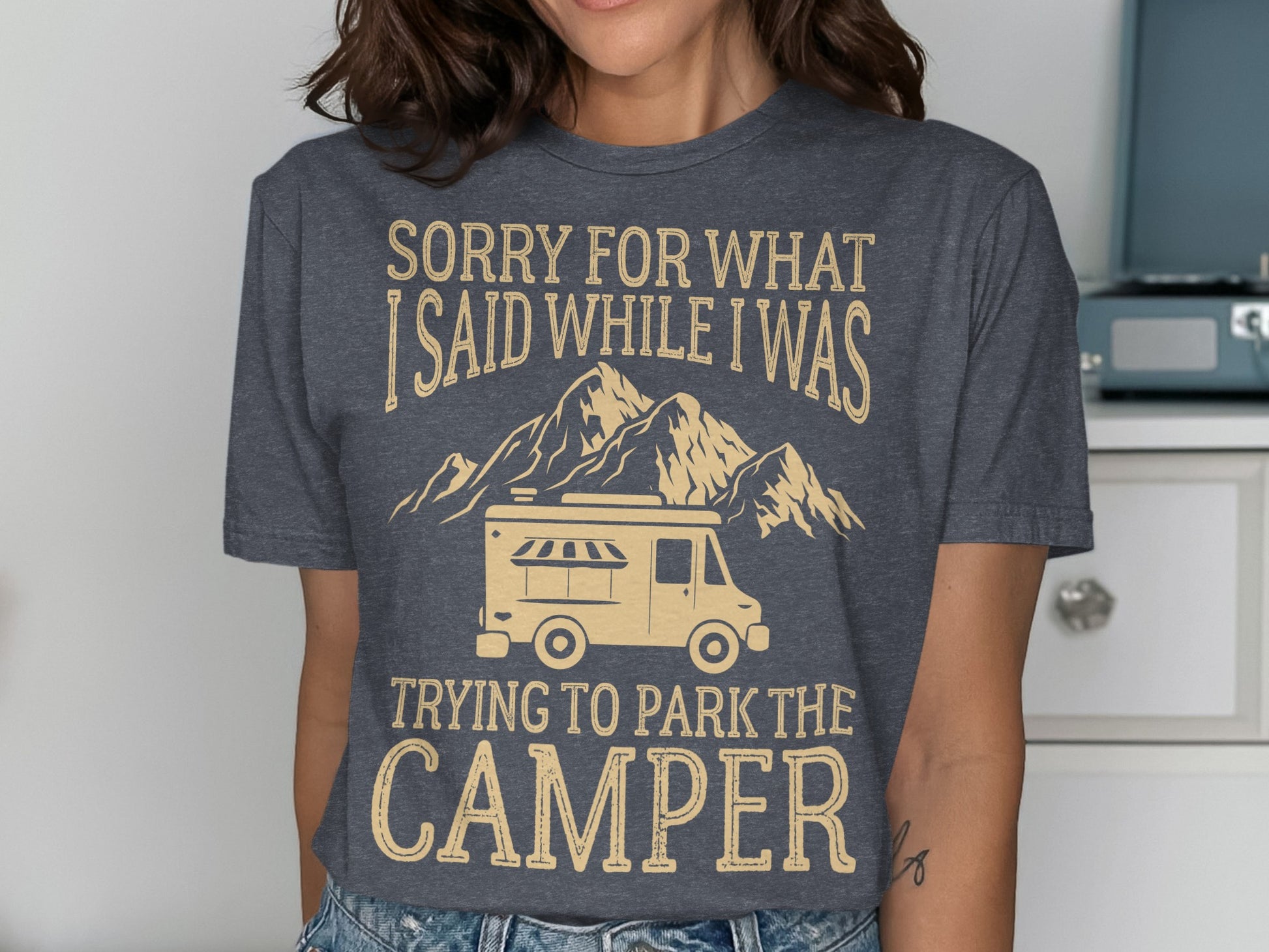 Gray t-shirt with text "Sorry for what I said while trying to park the camper" and a camper van graphic.