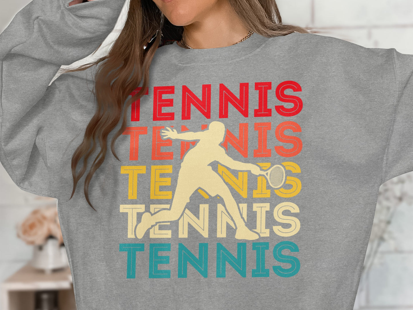 Grey sweatshirt with "TENNIS" in red, orange, yellow, and blue, and a tennis player graphic.