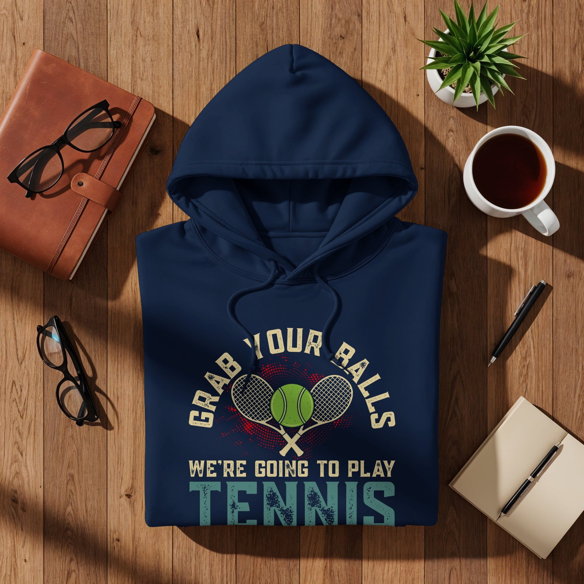 Navy hoodie with "Grab Your Balls We're Going to Play Tennis" text and tennis rackets.