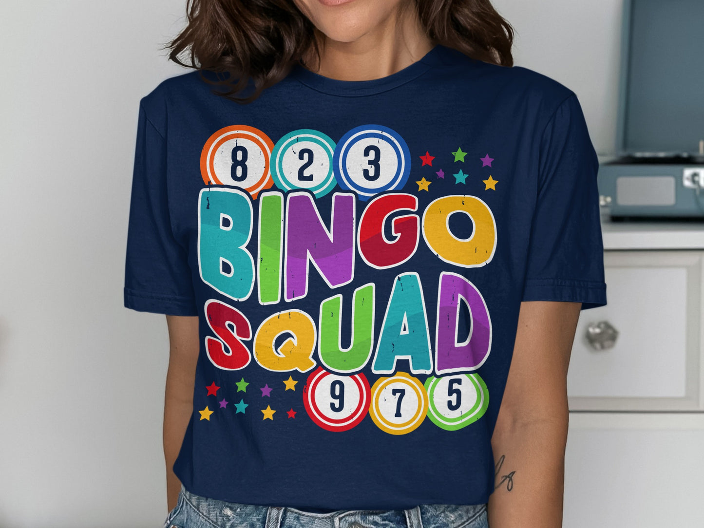 T-shirt with "BINGO SQUAD" in colorful letters and bingo balls.