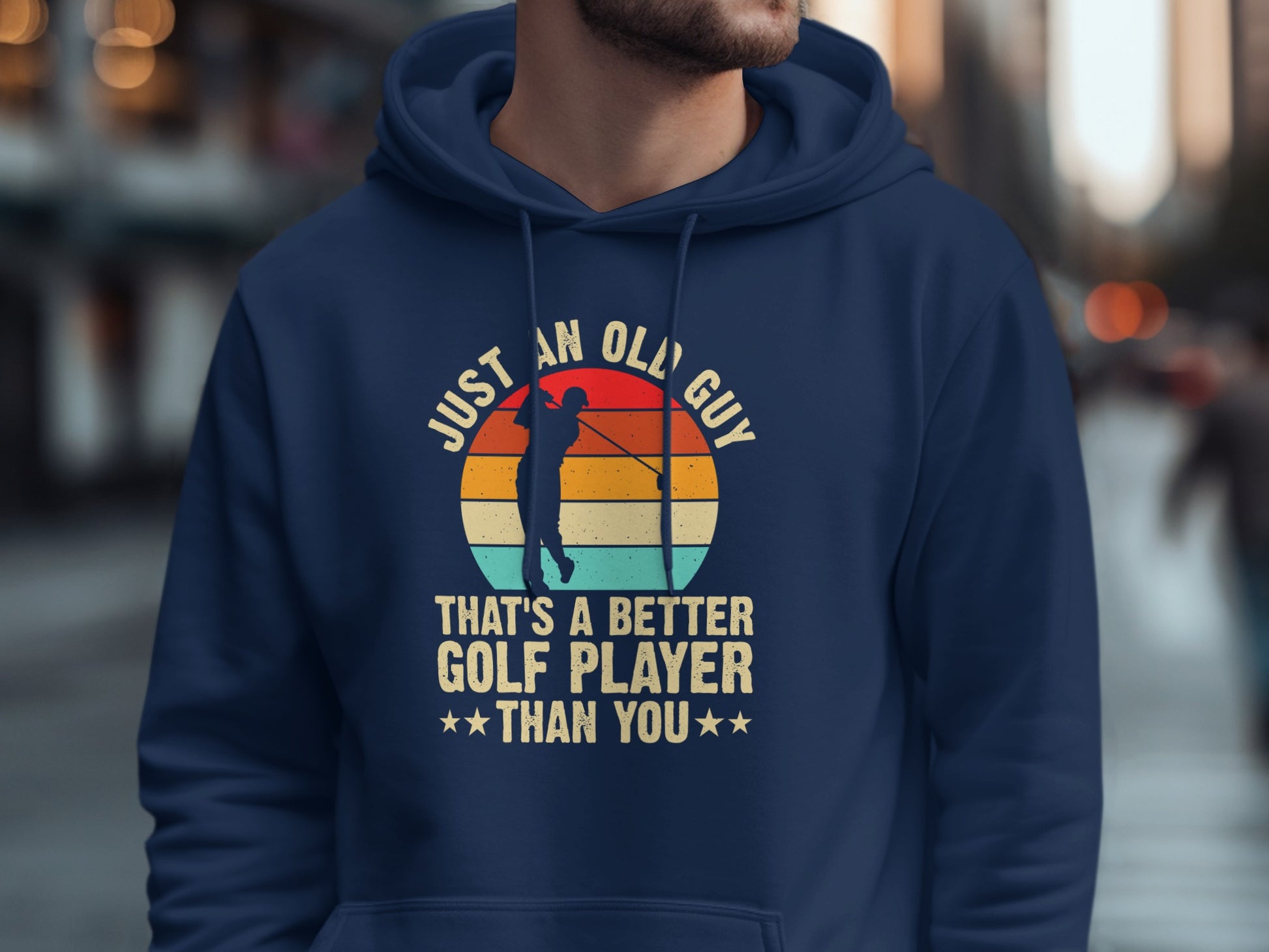 Navy hoodie with graphic of golfer and text "Just an old guy that's a better golf player than you".