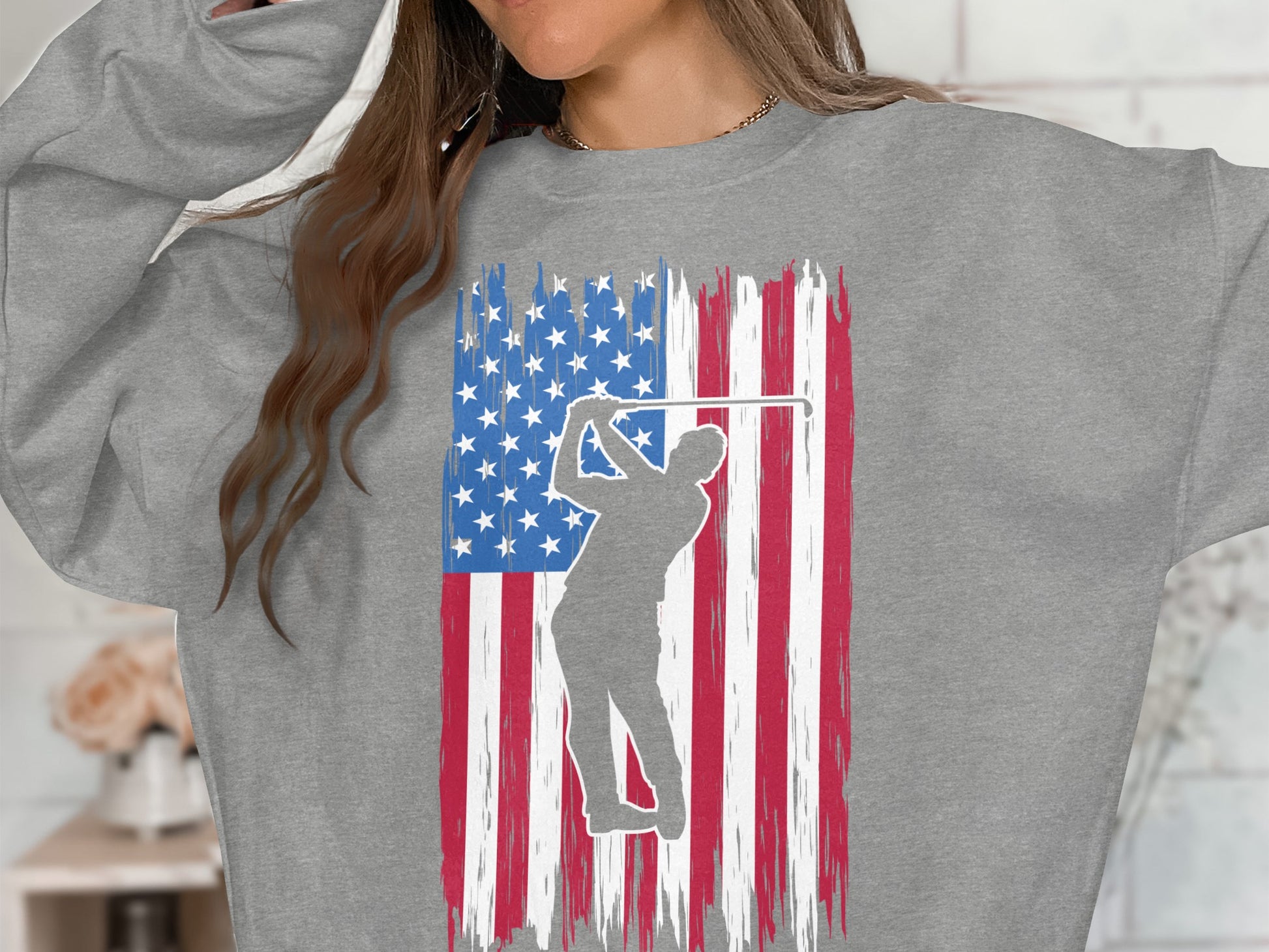 Gray sweatshirt with distressed American flag and golfer silhouette.