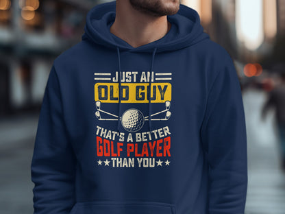 Navy hoodie with "Just an old guy that's a better golf player than you" text.