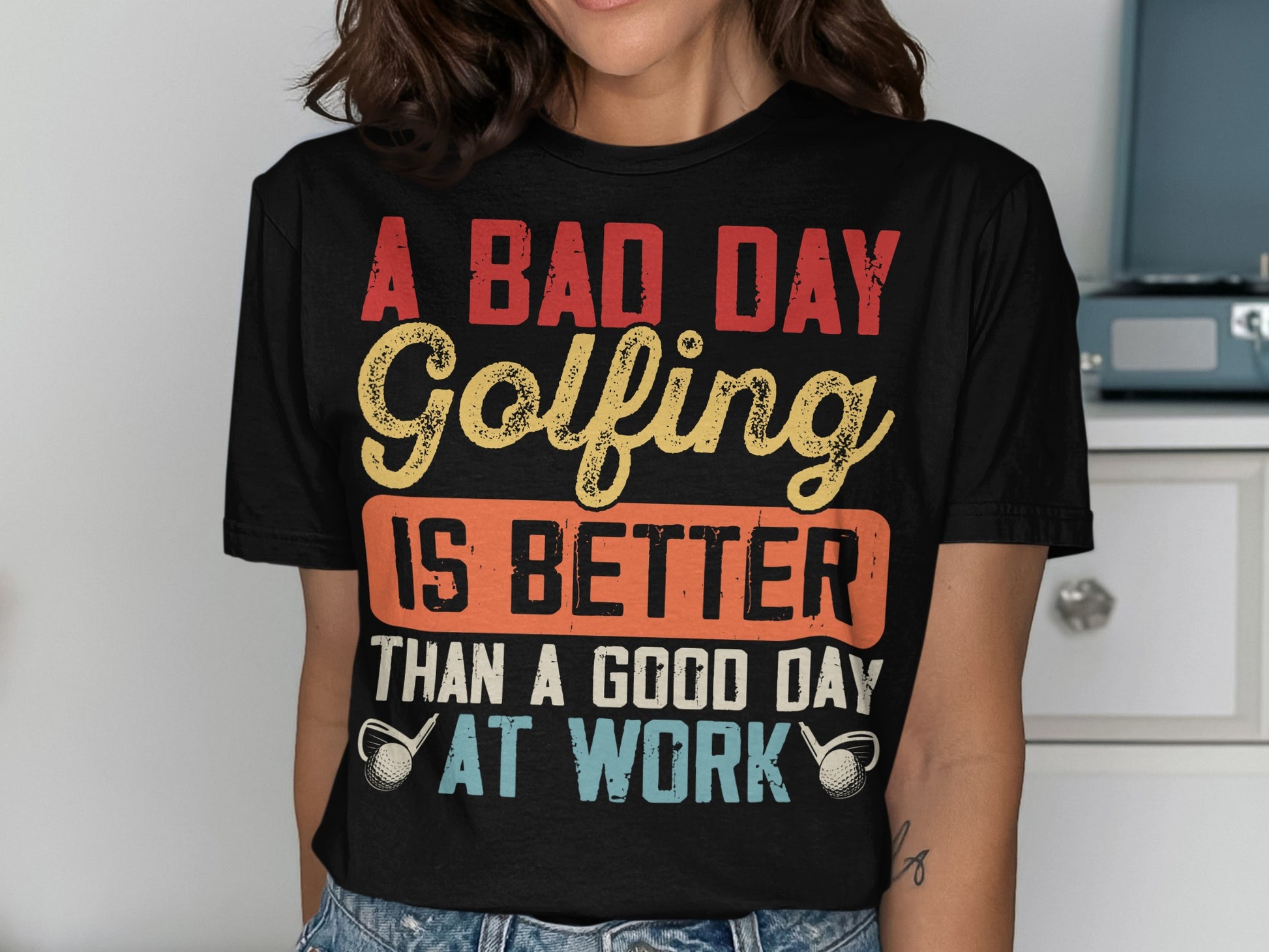 T-shirt with text "A bad day golfing is better than a good day at work".