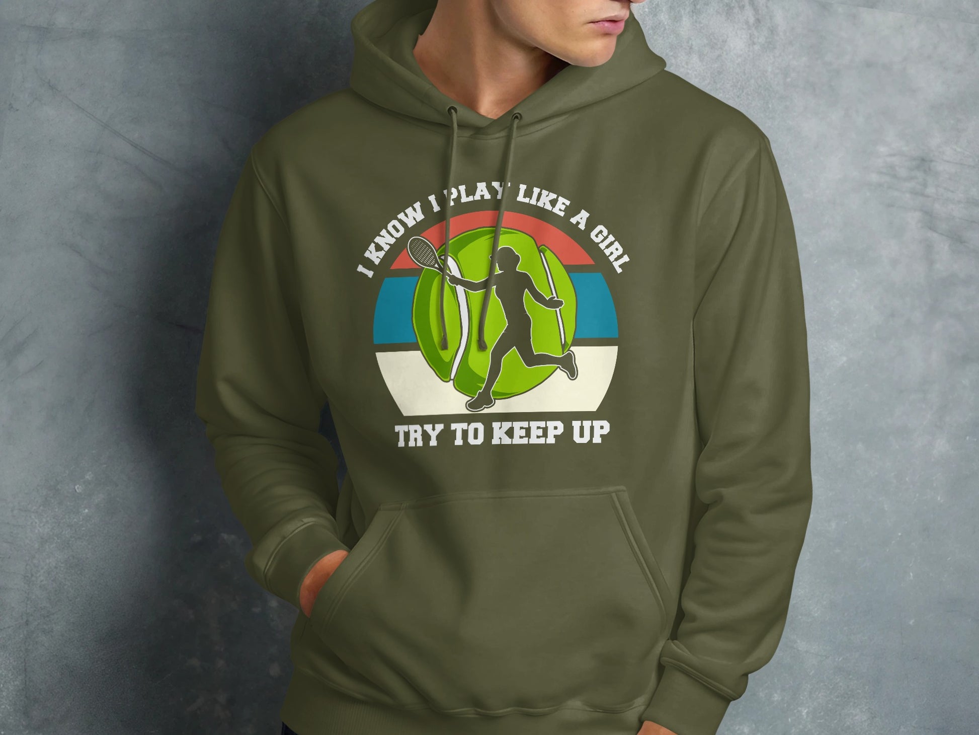 Green hoodie with graphic of tennis player and text "I know I play like a girl. Try to keep up."