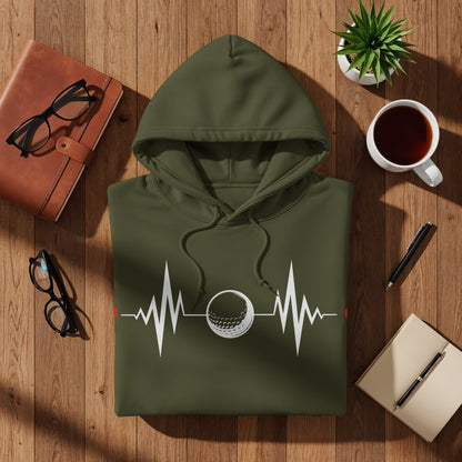Olive green hoodie with golf ball heartbeat design, eyeglasses, coffee, and notebook.