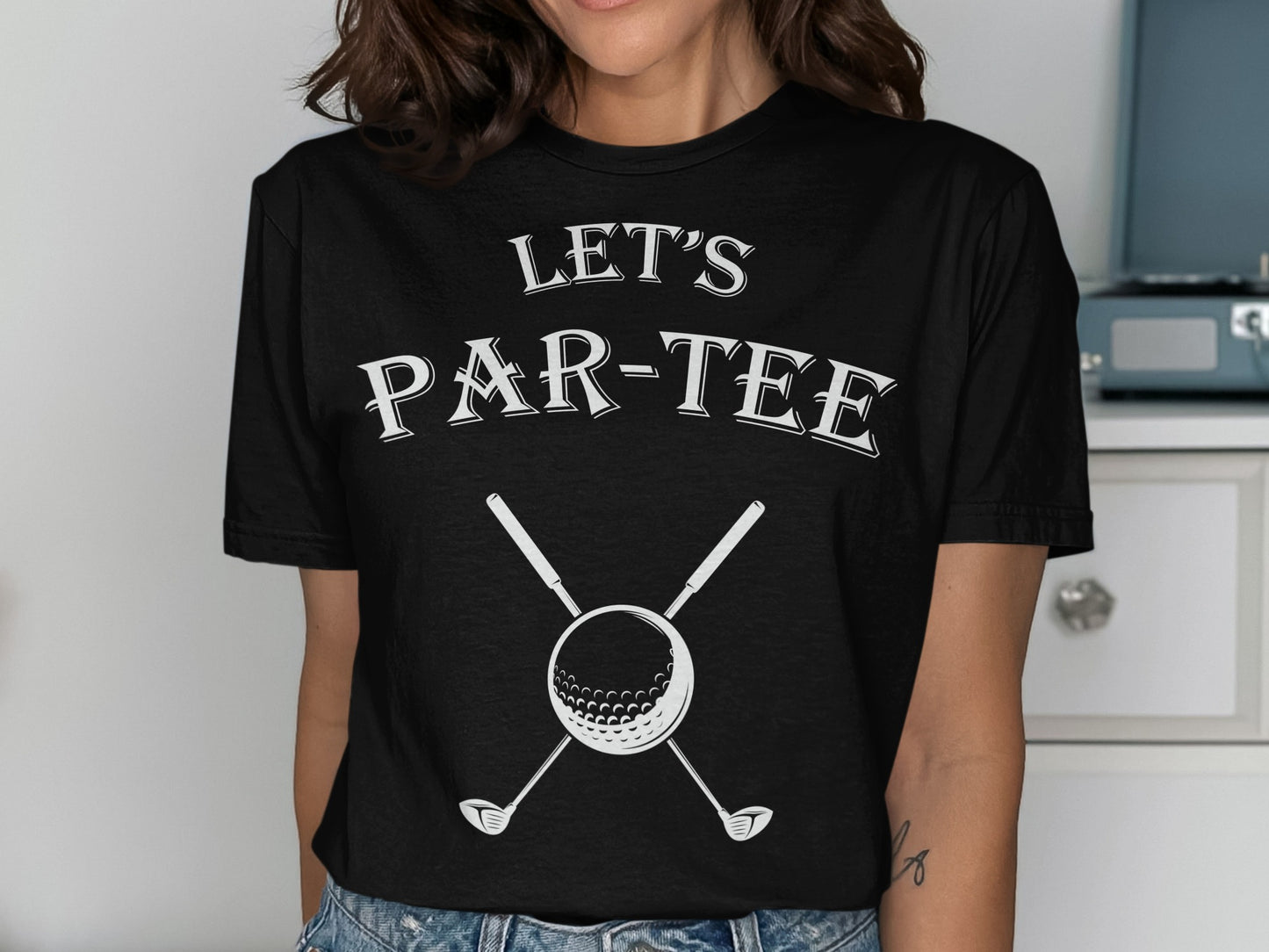Black t-shirt with "Let's Par-Tee" text and crossed golf clubs over a ball.