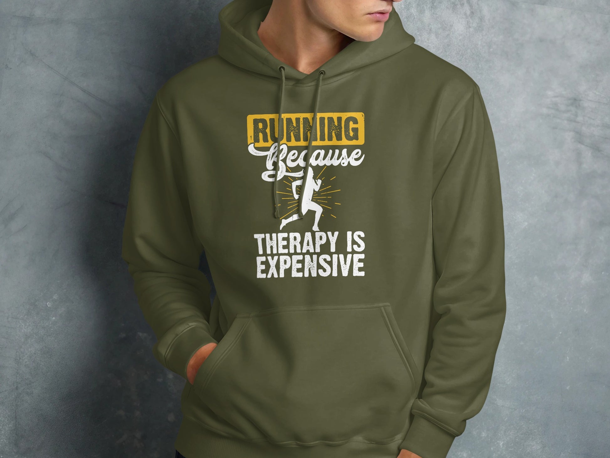 Green hooded sweatshirt with "Running because therapy is expensive" text and runner graphic.