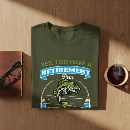 Green t-shirt with "Yes, I Do Have A Retirement Plan" text and fish graphic.