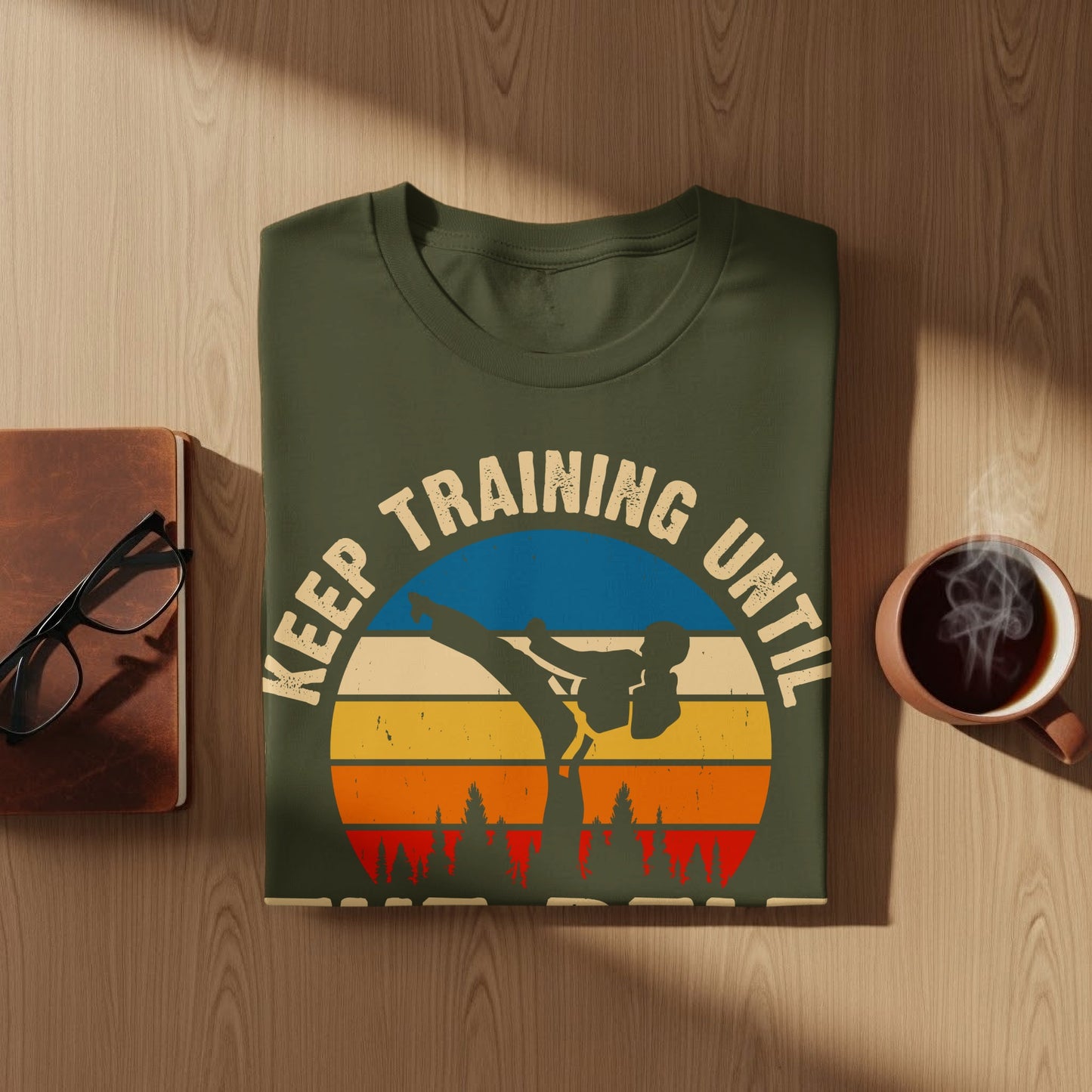 Green t-shirt with "Keep Training Until" text and karate silhouette.