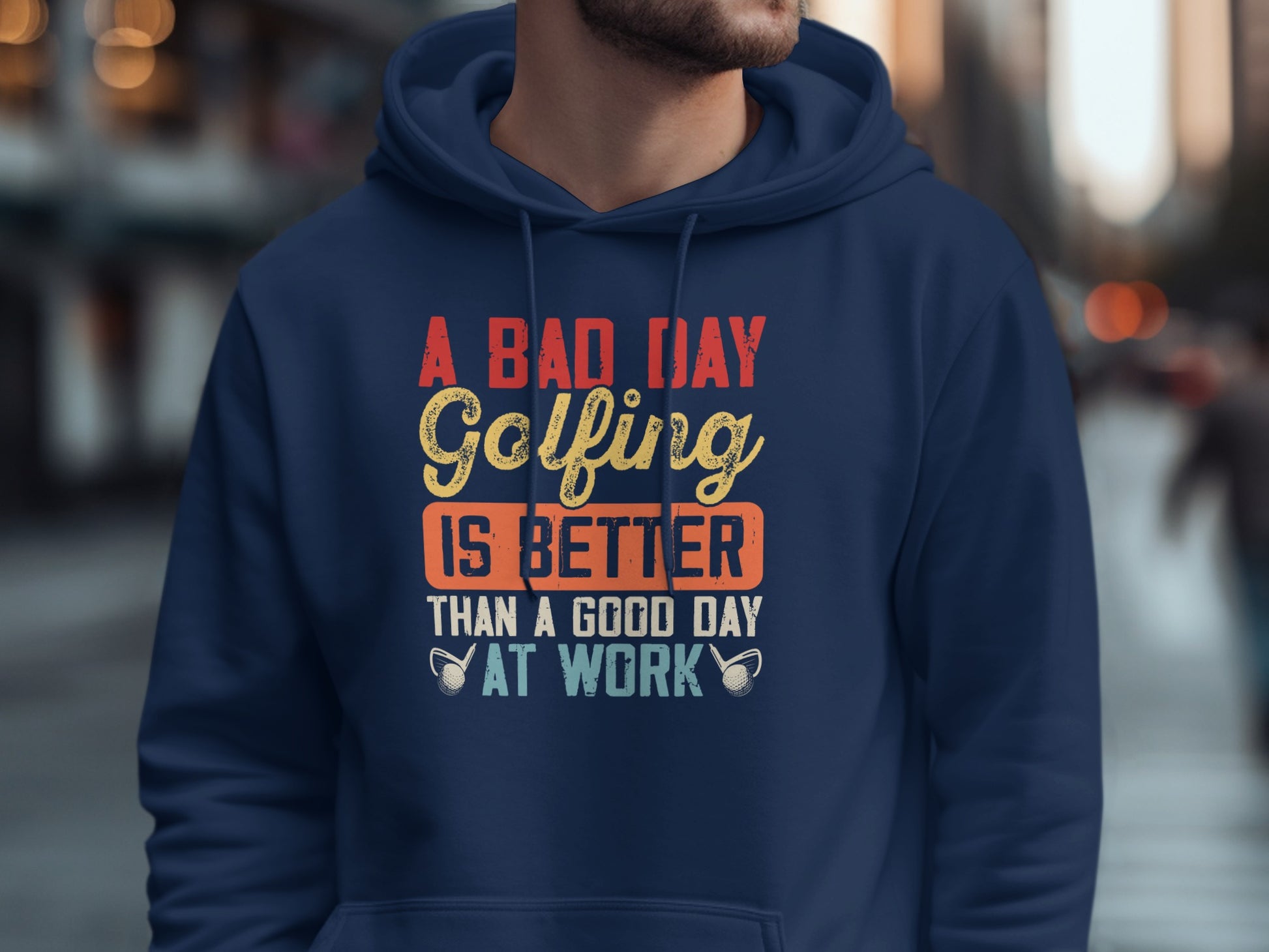 Navy blue hoodie with "A Bad Day Golfing Is Better Than A Good Day At Work" text.