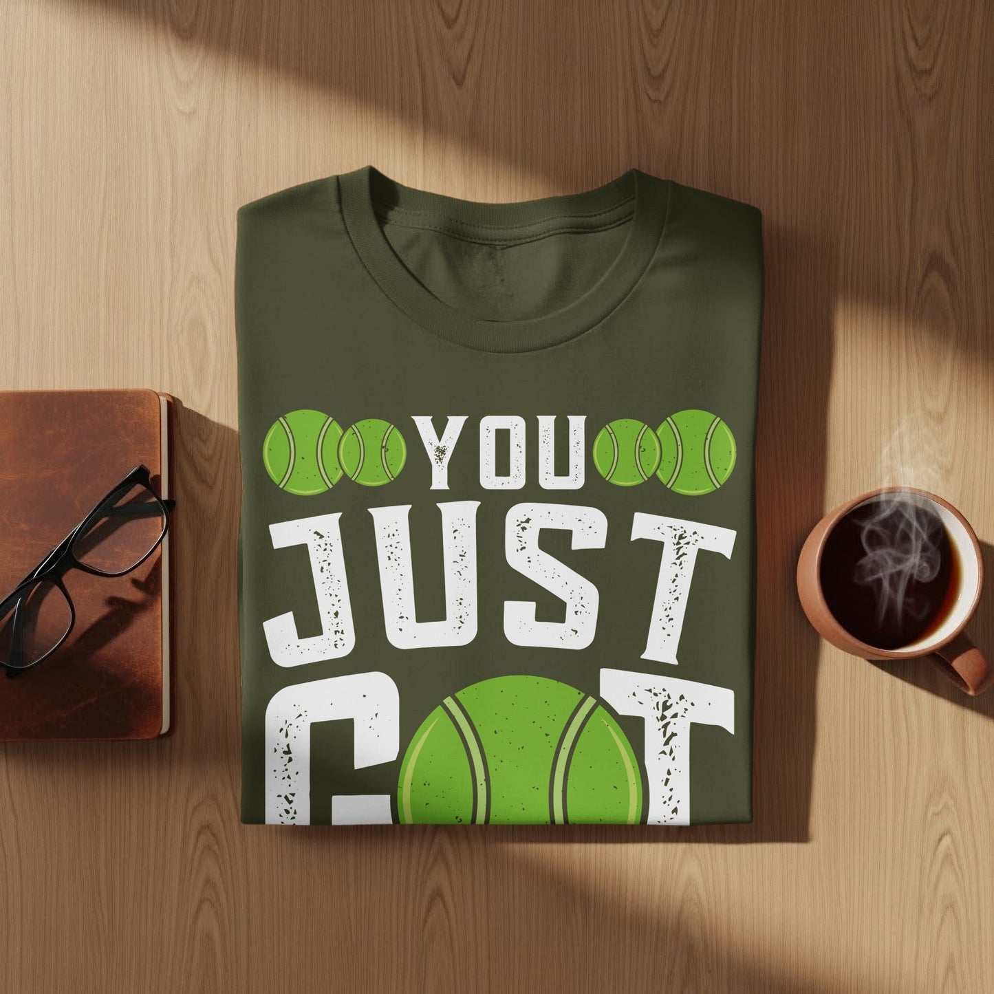 Green t-shirt with "YOU JUST GOT" and tennis ball graphic.
