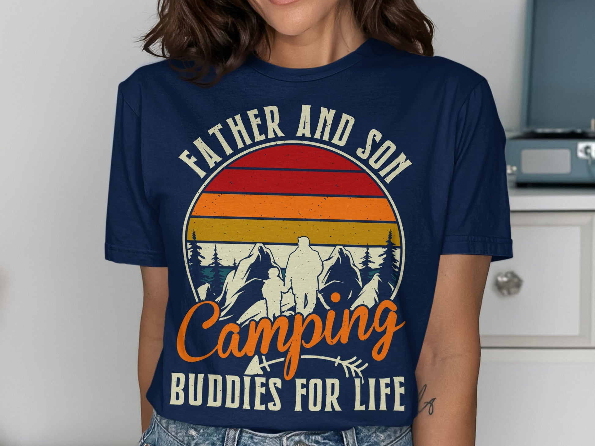 Father and Son Camping Buddies For Life graphic on a navy t-shirt.