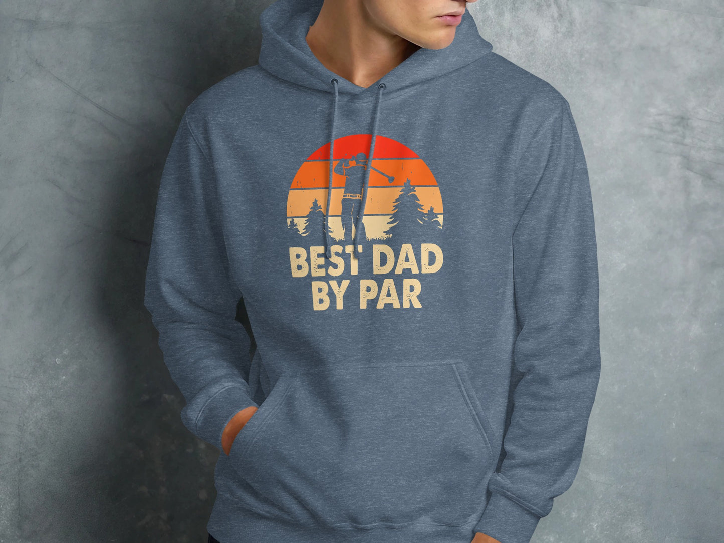Graphic hoodie with "BEST DAD BY PAR" text and golf sunset design.