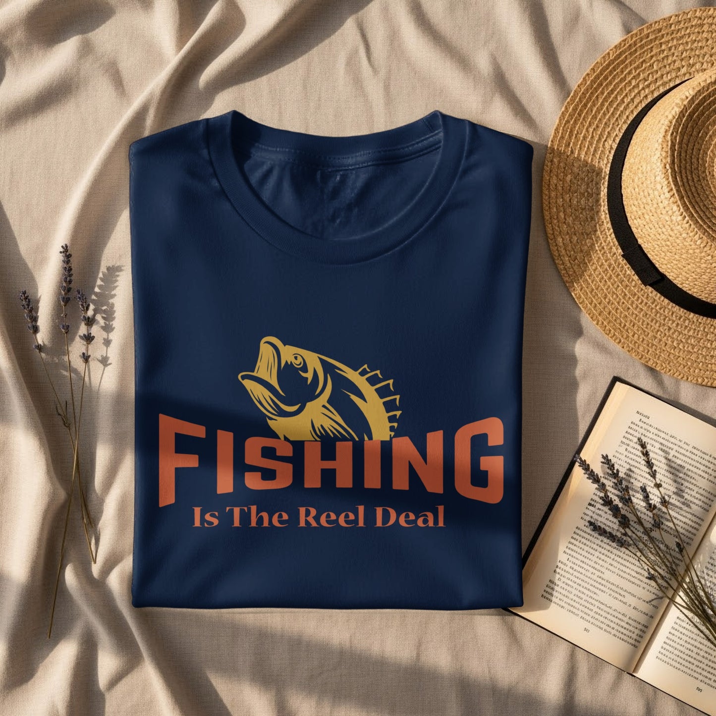 Navy t-shirt with "Fishing Is The Reel Deal" text and fish graphic.