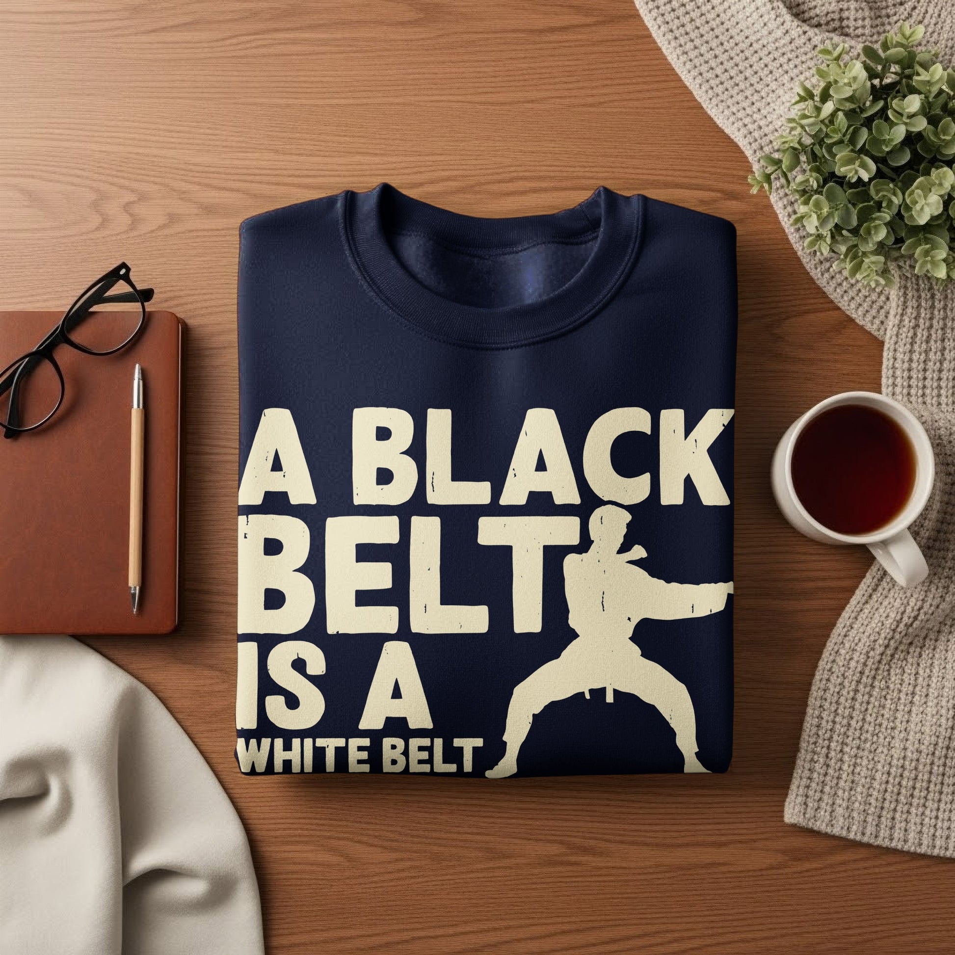 Navy sweatshirt with white text "A Black Belt Is A White Belt" and a karate silhouette.