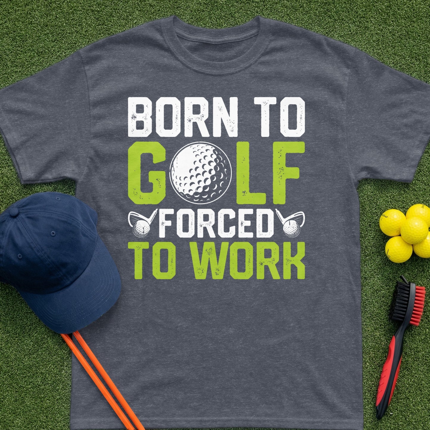 T-shirt with "Born to Golf Forced to Work" text and golf accessories.