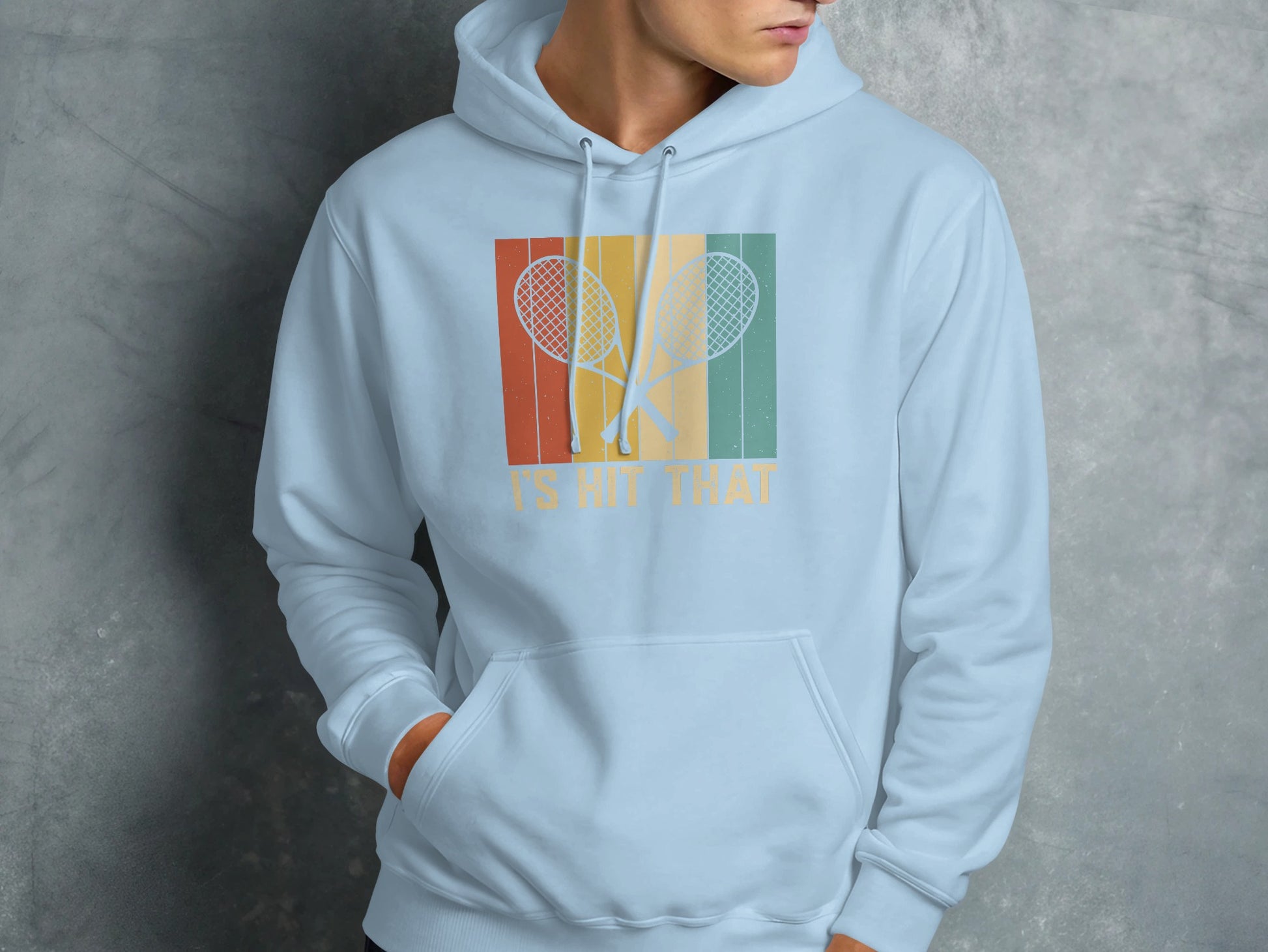 Light blue hoodie with retro tennis rackets and text: "IS IT HIT THAT"