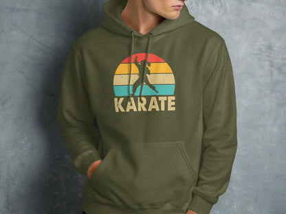 Olive green hoodie with a retro sunset karate graphic.