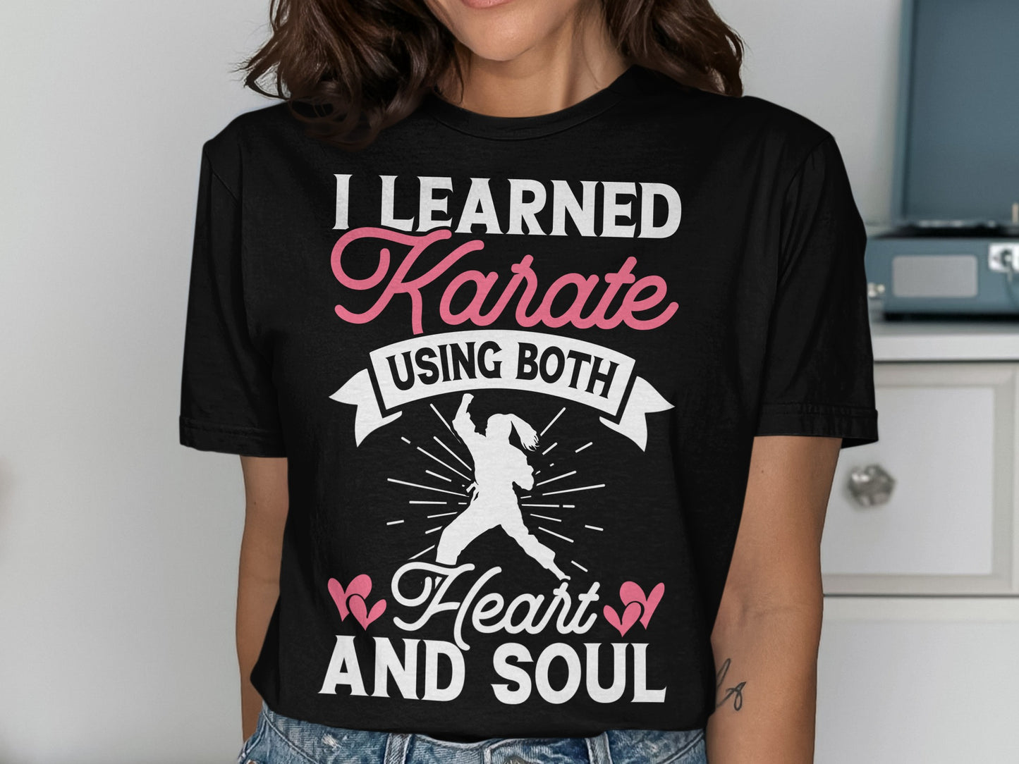 Black t-shirt with "I Learned Karate Using Both Heart and Soul" text.