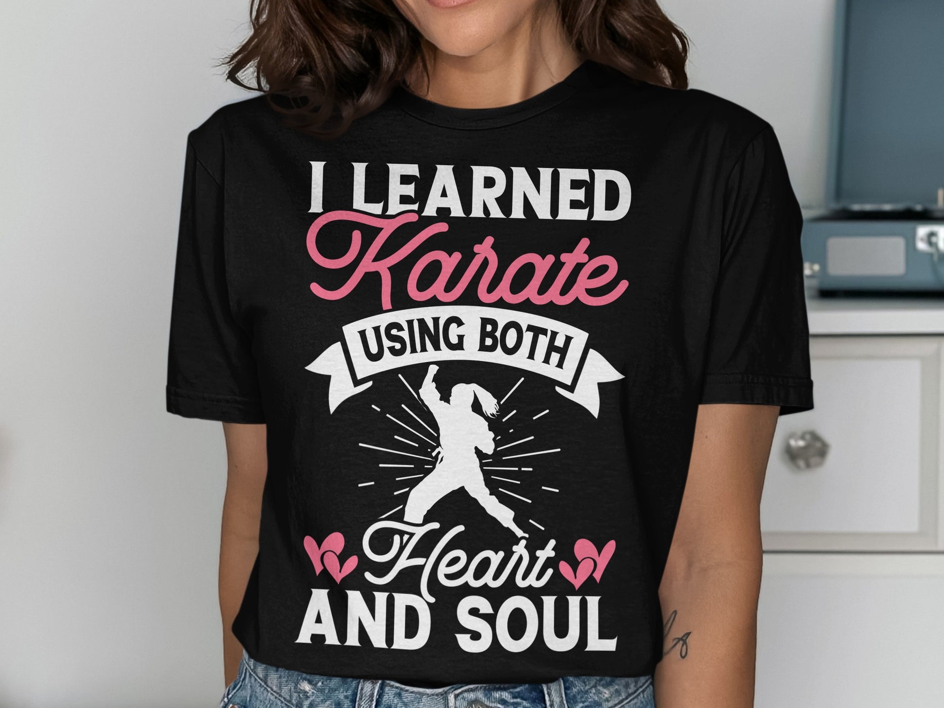Black t-shirt with "I Learned Karate Using Both Heart and Soul" text.
