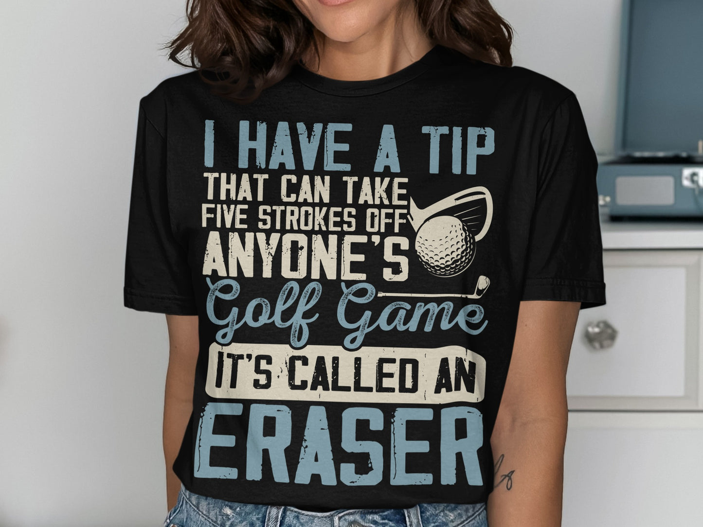 Black t-shirt with white text about golf and an eraser.