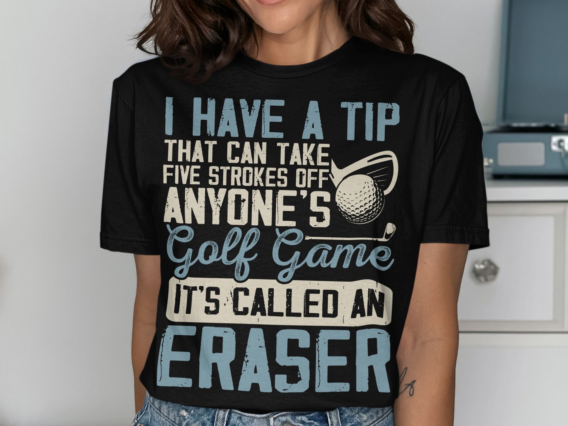 Black t-shirt with white text about golf and an eraser.