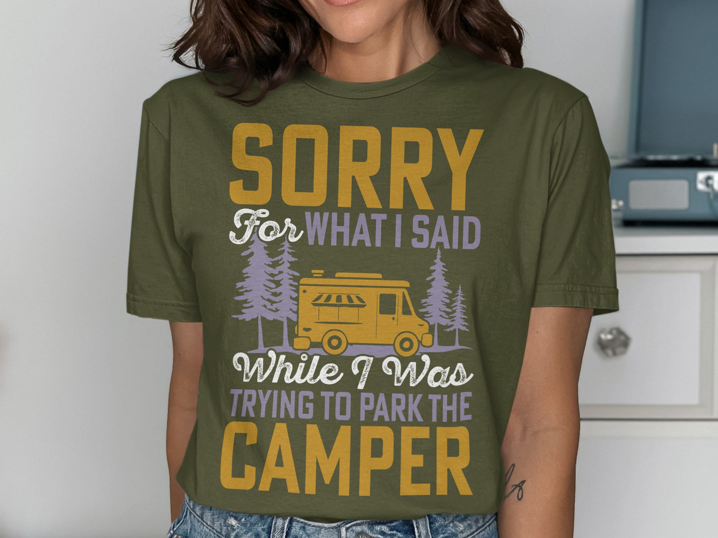 Olive green t-shirt with "Sorry for what I said while I was trying to park the camper" text.