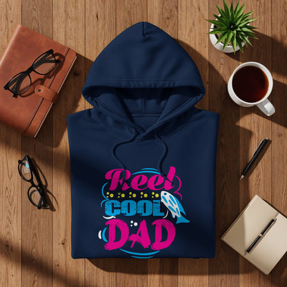 Navy hoodie with "Reel Cool Dad" text in colorful bubble letters.