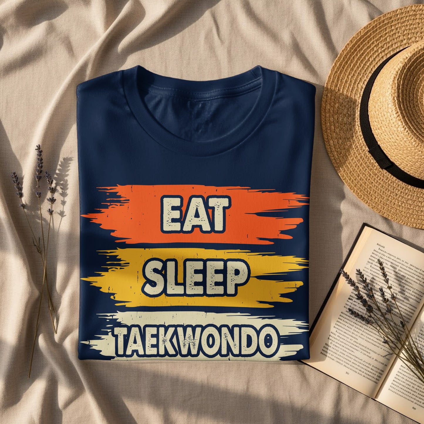 Navy t-shirt with "Eat Sleep Taekwondo" text in distressed orange, yellow, and blue.